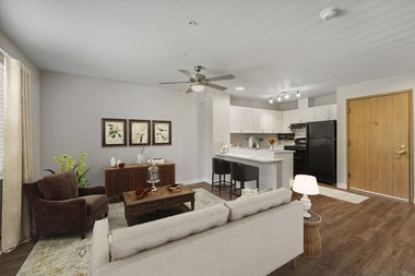 Apartments in Federal Way for Rent - Meridian Court - Ceiling Fan, Tan Window Drapes, Brown Area Rug, and Wood-Style Flooring