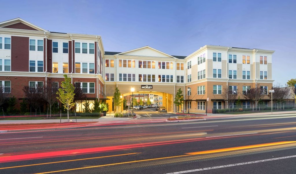 Street entrance at dusk at The Moxley in Fairfax VA