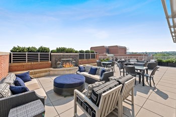 Rooftop terrace fireplace and chairs at Bradley Braddock Road Station Apartments in Alexandria VA - Photo Gallery 21