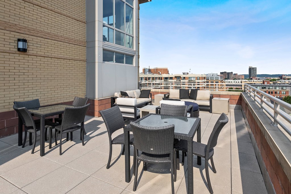 Rooftop terrace tables and chairs at Bradley Braddock Road Station Apartments in Alexandria VA