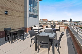 Rooftop terrace tables and chairs at Bradley Braddock Road Station Apartments in Alexandria VA - Photo Gallery 23