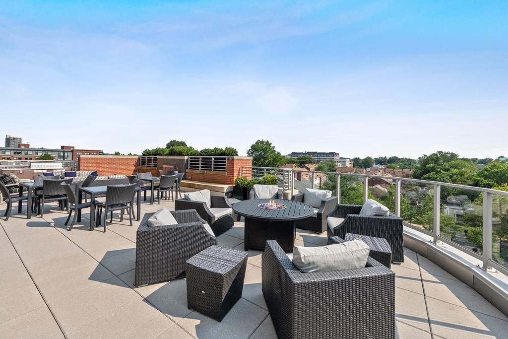 Terrace seating area chairs at Bradley Braddock Road Station Apartments in Alexandria VA