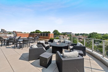 Terrace seating area chairs at Bradley Braddock Road Station Apartments in Alexandria VA - Photo Gallery 22