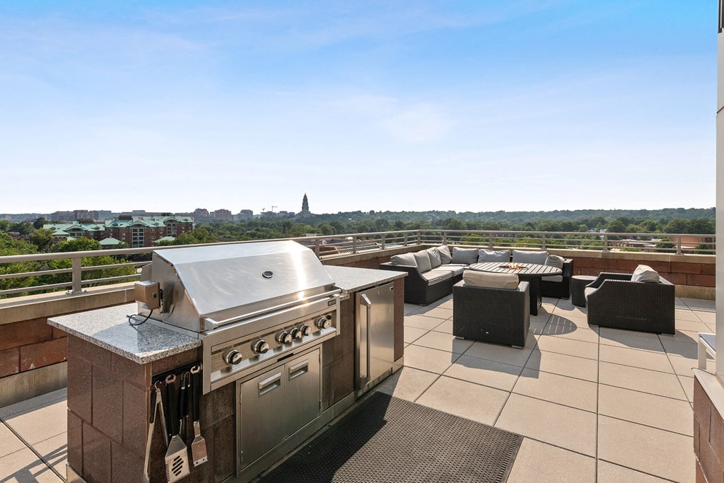 Outdoor terrance barbecue grill at Bradley Braddock Road Station Apartments in Alexandria VA