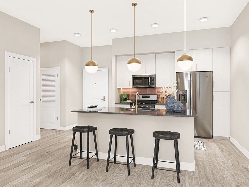 Terracotta scheme kitchen with island seating at West Village Poway Apartments in Poway CA
