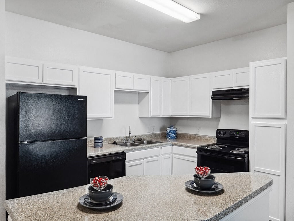 Kitchen with appliances at Tidwell Estates in Houston TX