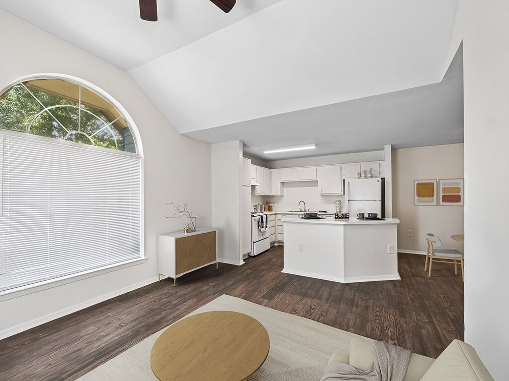 Living room with ceiling fan at Tidwell Estates in Houston TX