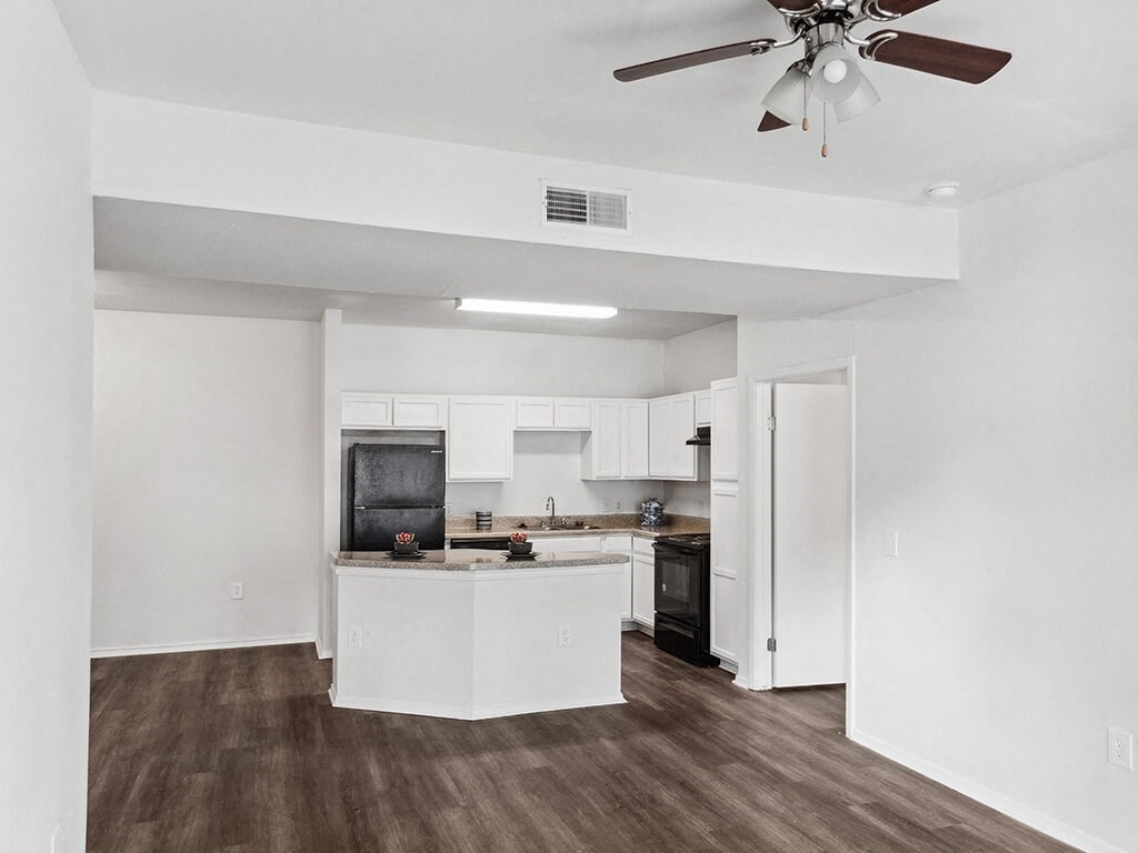 Living room with view of kitchen at Tidwell Estates in Houston TX