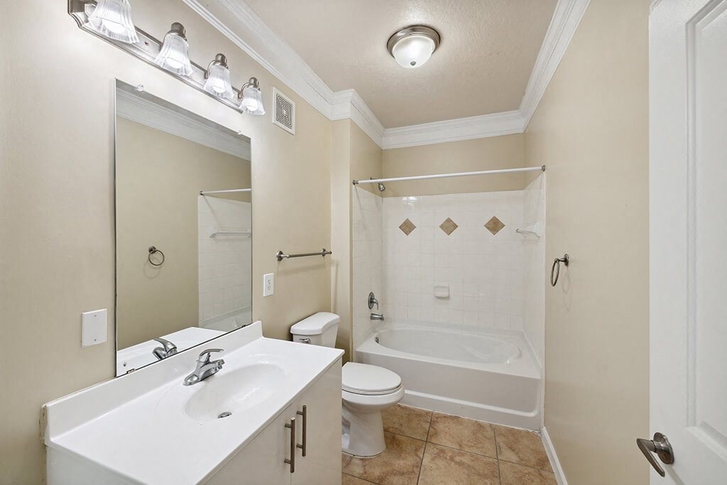 a bathroom with a sink toilet and a shower