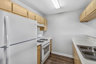 https://cdngeneral.rentcafe.com/dmslivecafe/2/97184/Vacant%20Apartment%20Kitchen%20at%20Harvard%20Yard%20Apartments%20in%20Los%20Angeles%20CA.jpg?width=330&quality=80
