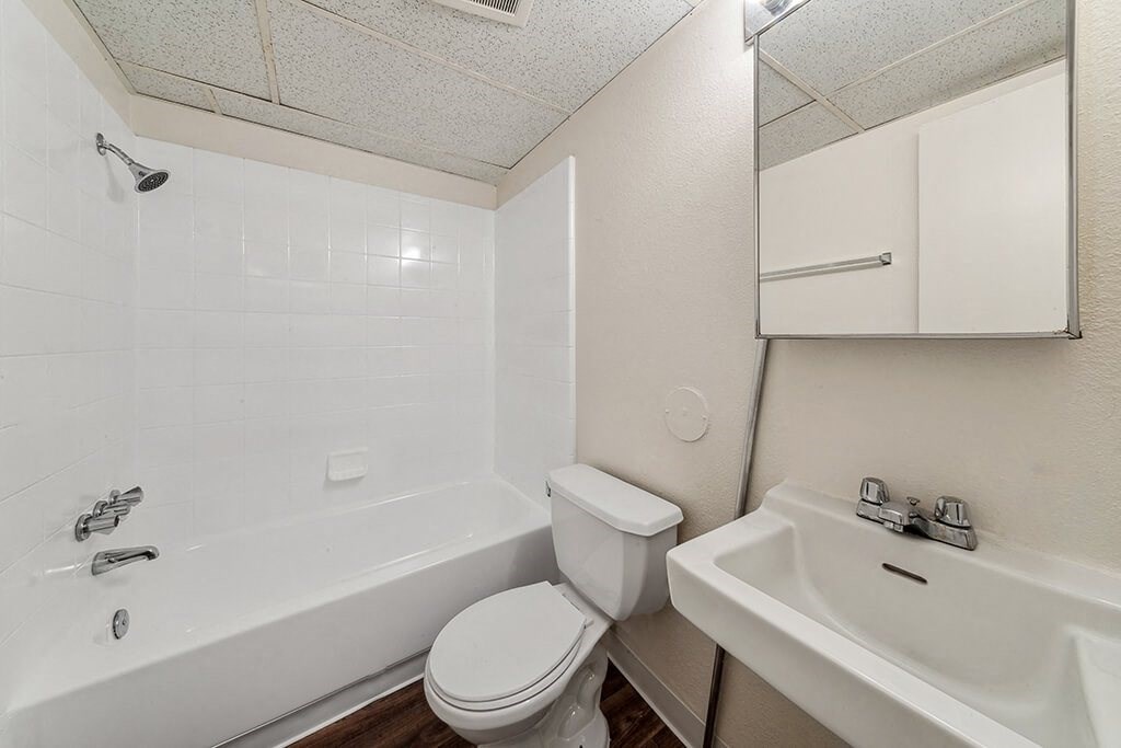Bathroom with sink and tub at Ridgemoor Apartment Homes in Lakewood CO