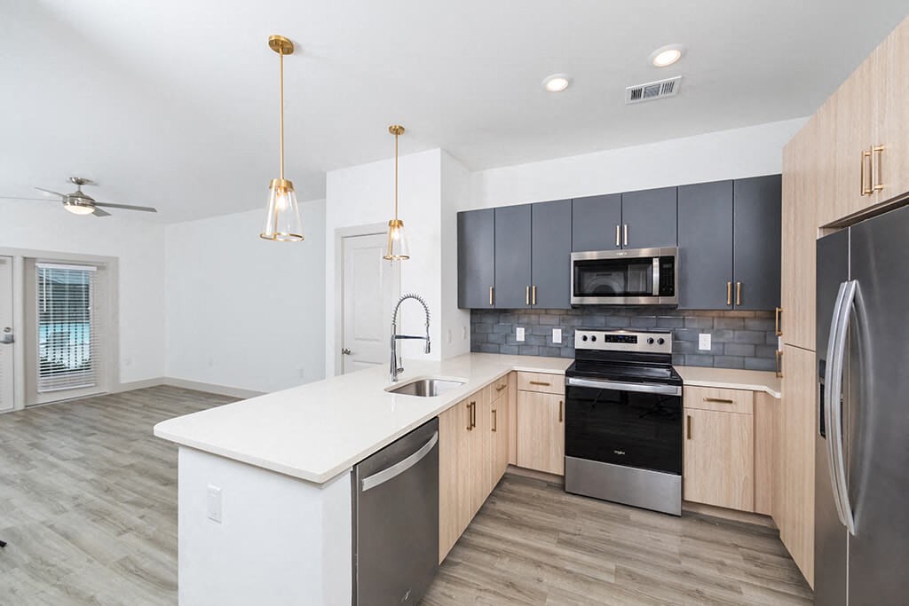 Kitchen with sleek appliances at 1900 Parmer Apartments in Austin TX