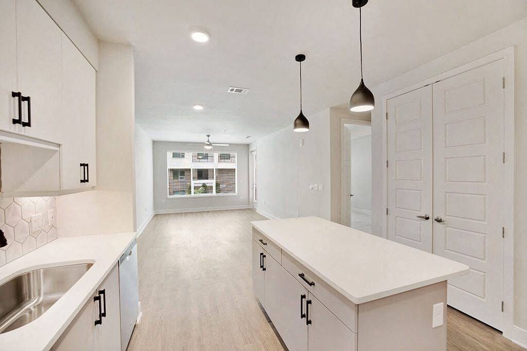 Chrome Design Package Kitchen and Living Room at 1810 Main Apartments in Houston TX