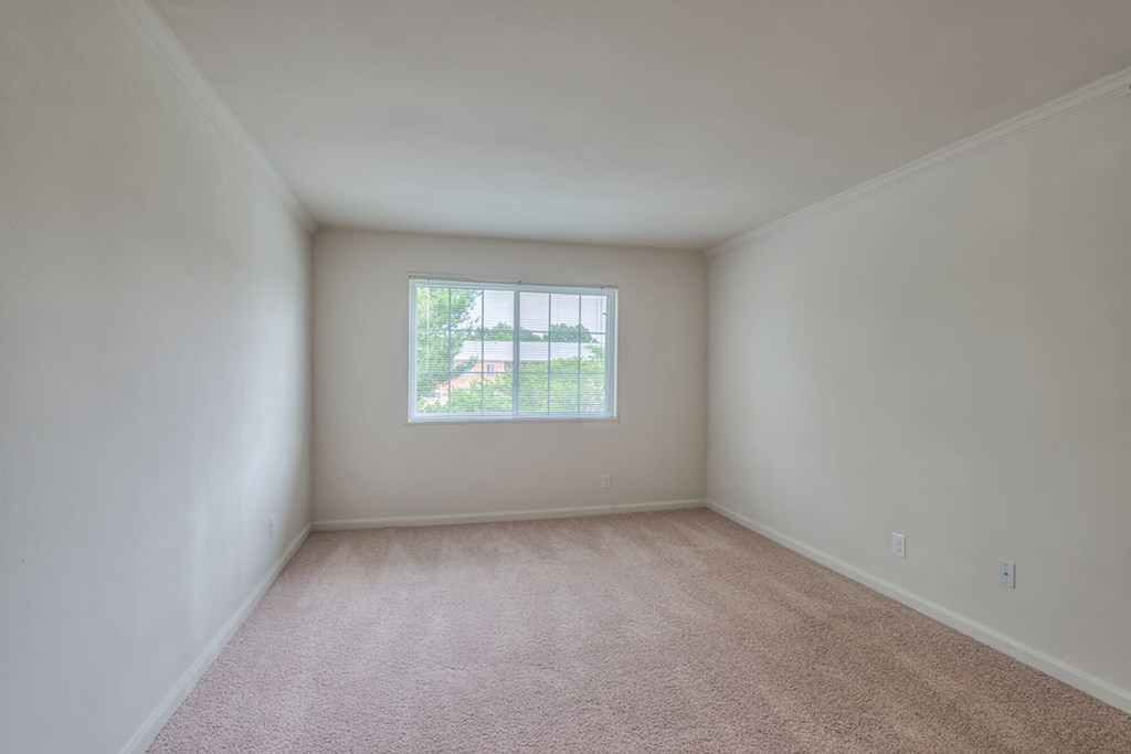 Bedroom with window at Leesburg Apartments in Leesburg VA