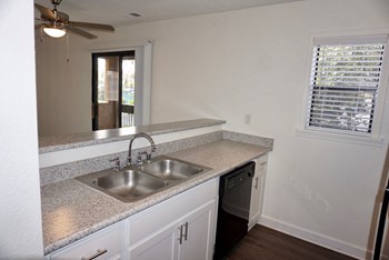 Kitchen sink looking to Living Room at Hilltop Commons Apartments in San Pablo CA - Photo Gallery 2