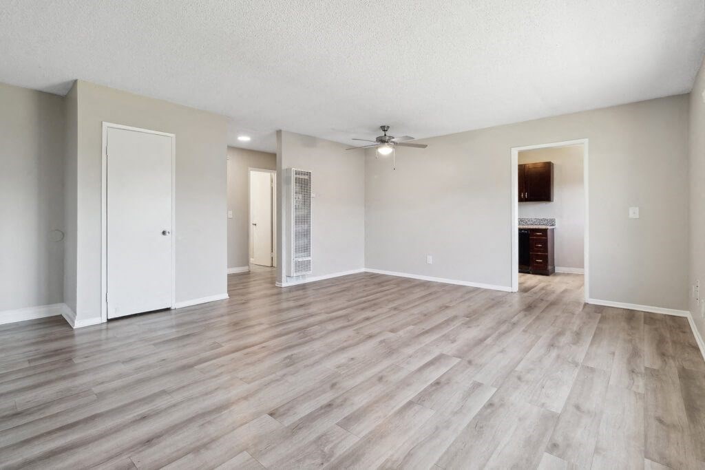 Living room with hardwood flooring at Park Crest Apartments in San Diego CA
