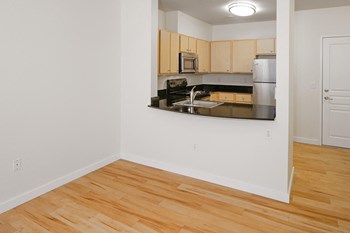 Vacant Living Room and Kitchen at Collins Circle Apartments in Portland OR - Photo Gallery 2