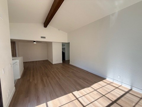 A room with wooden floors and white walls.