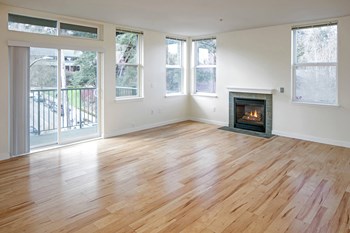 Vacant Living Room with Fireplace at Collins Circle Apartments in Portland OR - Photo Gallery 3