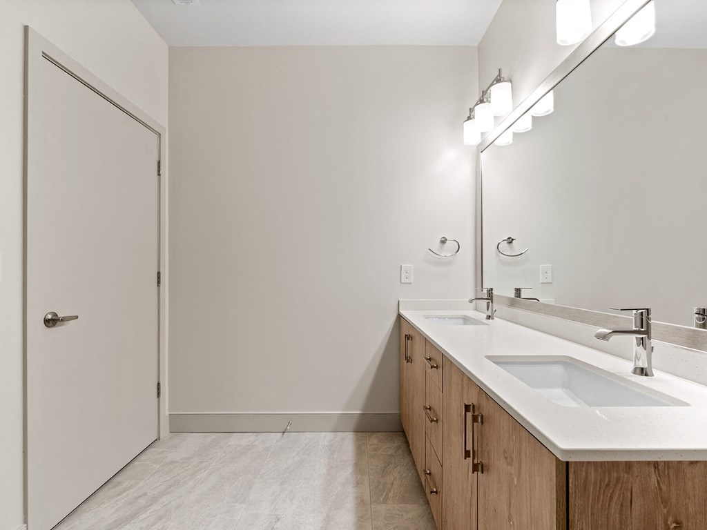 Vacant bathroom double sink at VERO Apartments in Chelsea MA