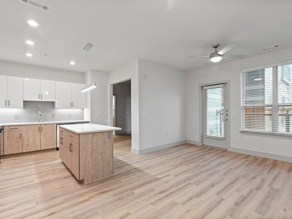 Vacant kitchen and living room at VERO Apartments in Chelsea MA