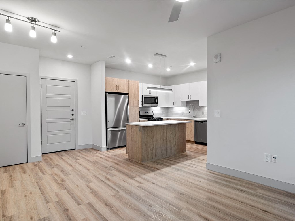 Vacant living room and kitchen at VERO Apartments in Chelsea MA