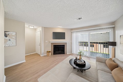 Living room with fireplace at Rock Peak on Sunset Apartments in Longmont CO