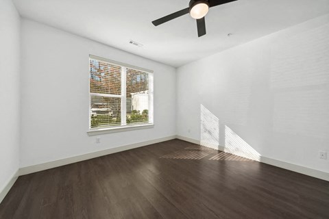 Bedroom with ceiling fan at The Quill in Milford MA