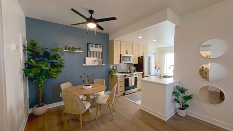 A dining room with a table and chairs is shown.