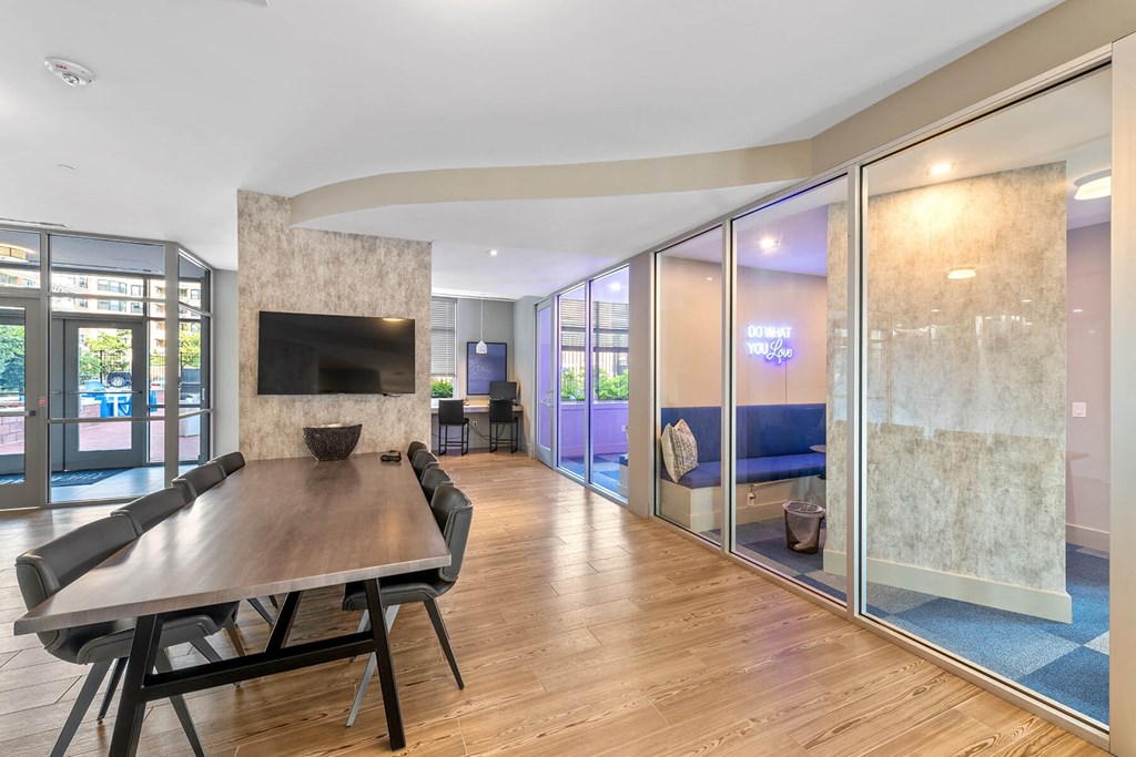 Resident clubhouse with conference table at Bradley Braddock Road Station Apartments in Alexandria VA