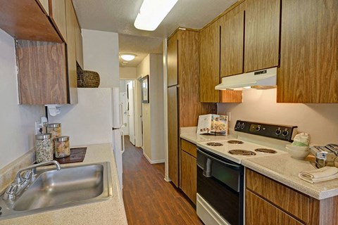 a kitchen with a stove and a sink