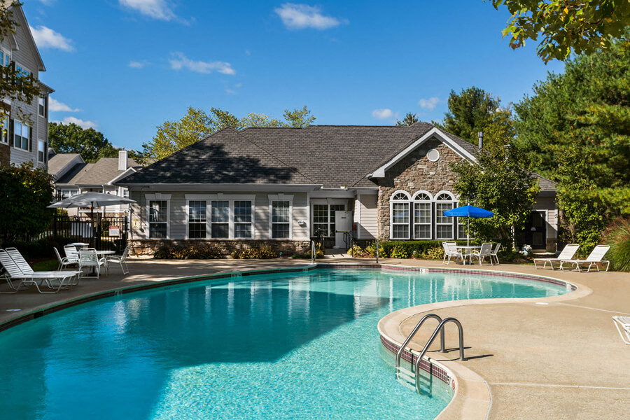Pool with sun deck at River Pointe at Den Rock Apartments in Lawrence, MA
