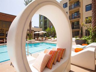 Covered pool seating at Terrena Apartments in Northridge, CA
