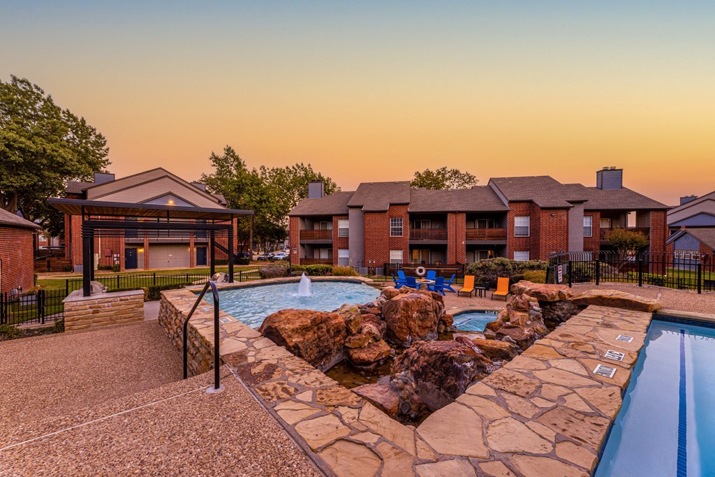 the preserve at ballantyne commons pool and spa with apartment buildings in the background