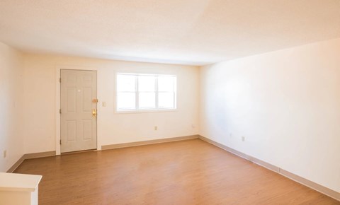 A room with a door and a window.