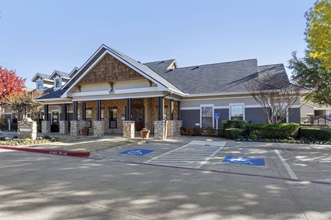 A building with a parking lot in front of it.