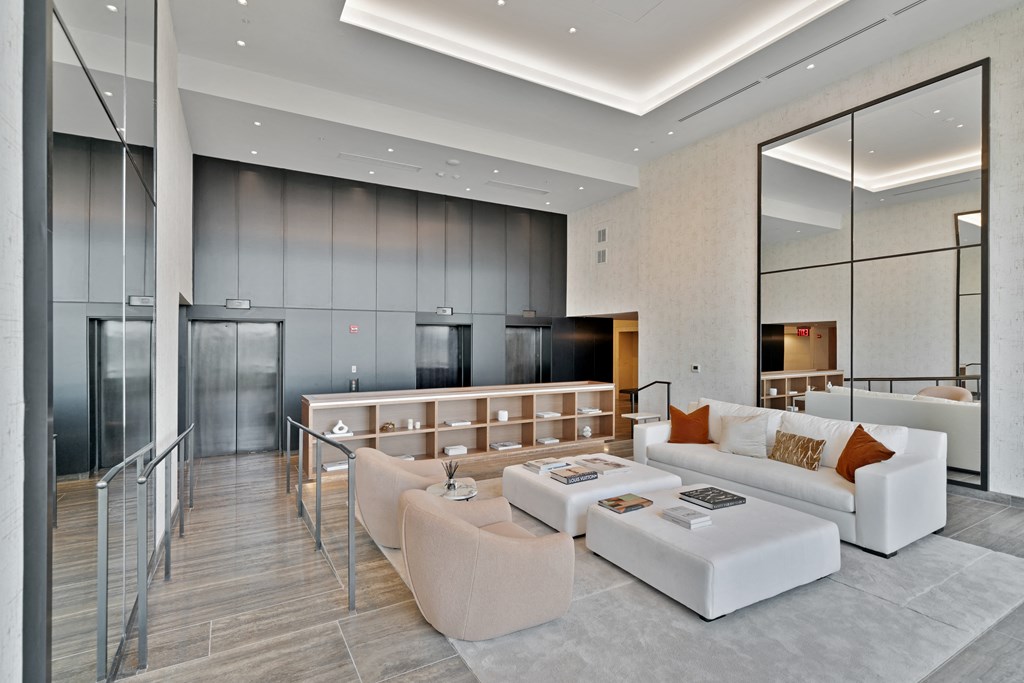 a large living room with a white couch and a table