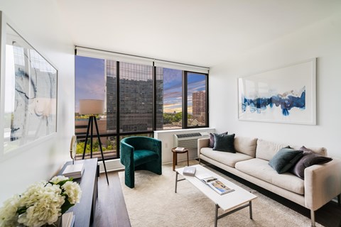 A living room with a couch, chair, and a coffee table.