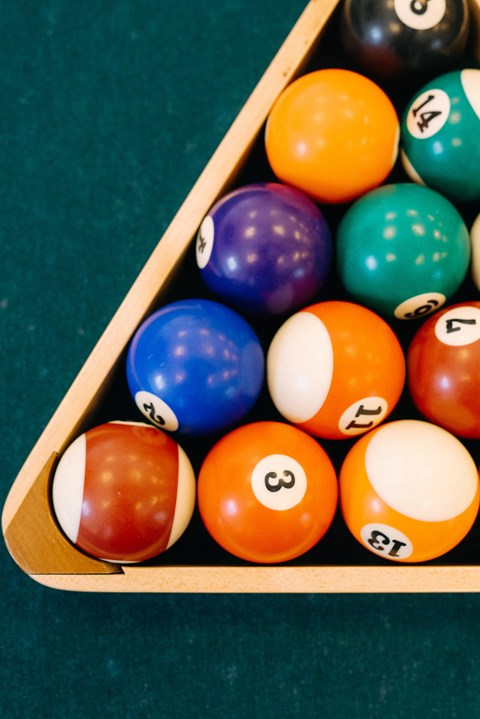 a set of billiard balls on a pool table