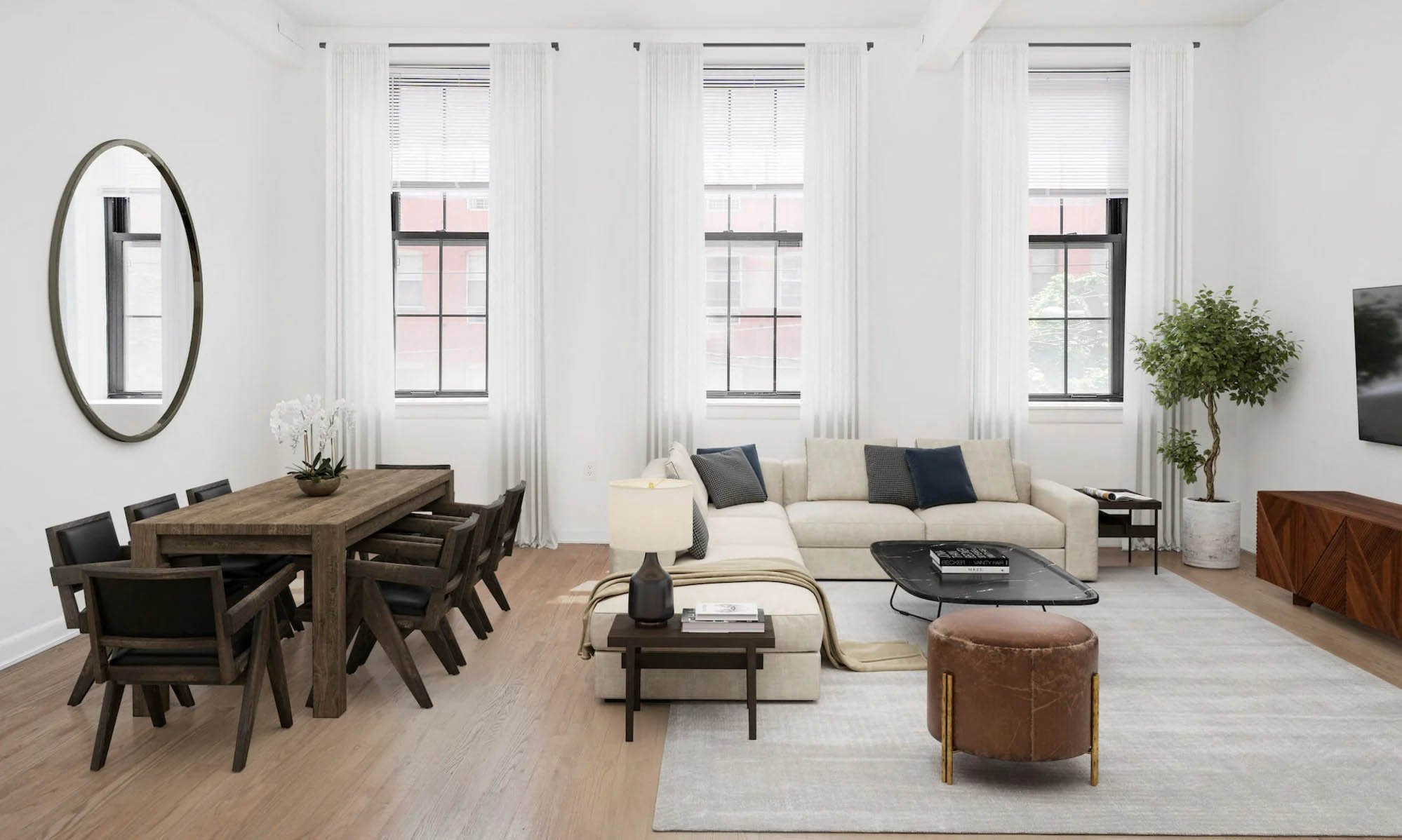 a living room with a couch and chairs and a table