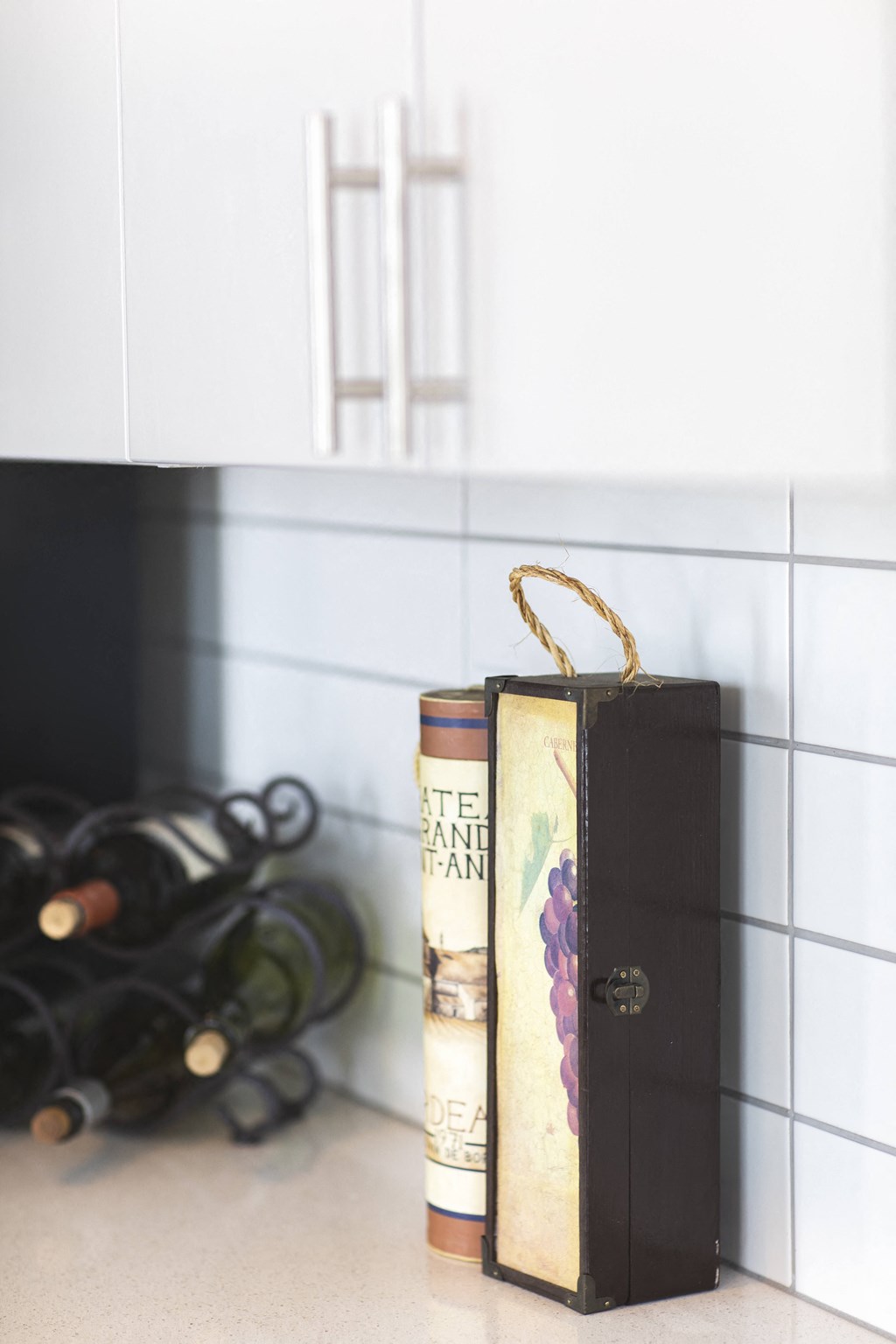 A book with a gold ribbon bookmark sits on a countertop.