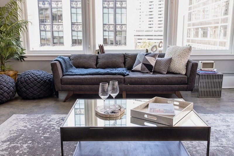 Living Room Filled with Furniture and a Large Table  at Fourteen56, Detroit, MI