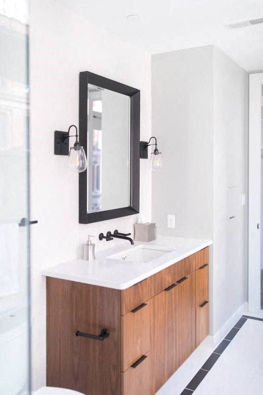 Bathroom with a Sink and a Mirror at Fourteen56, Detroit, MI