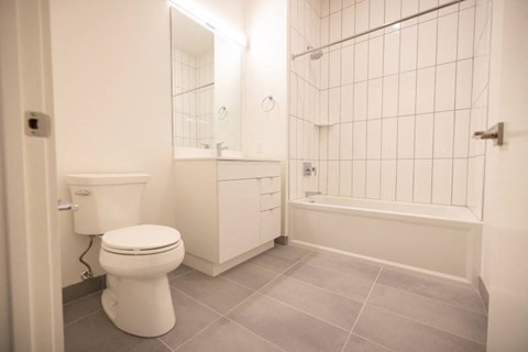a bathroom with a toilet sink and bathtub