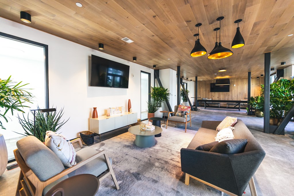 a living room filled with furniture and a flat screen tv