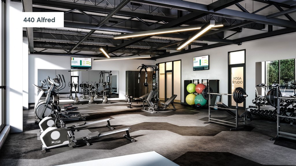 a gym with weights and other exercise equipment and a tv