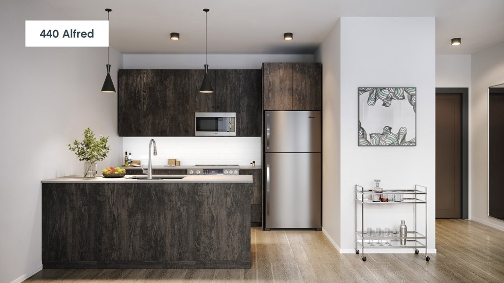 an image of a kitchen with stainless steel appliances and wood cabinets