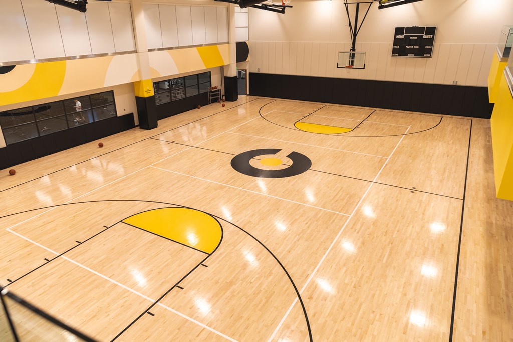 COR Wellness Center with a basketball court with a yellow circle in the middle.