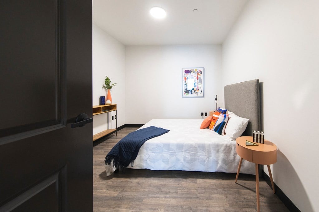 Gorgeous Bedroom Spacious bedroom with wall art and modern styling at The May.