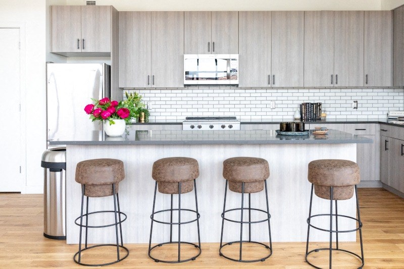 Kitchen Bar with Beige Stools at The Assembly, Detroit, MI